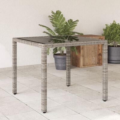 vidaXL Tuintafel met glazen blad 90x90x75 cm poly rattan grijs