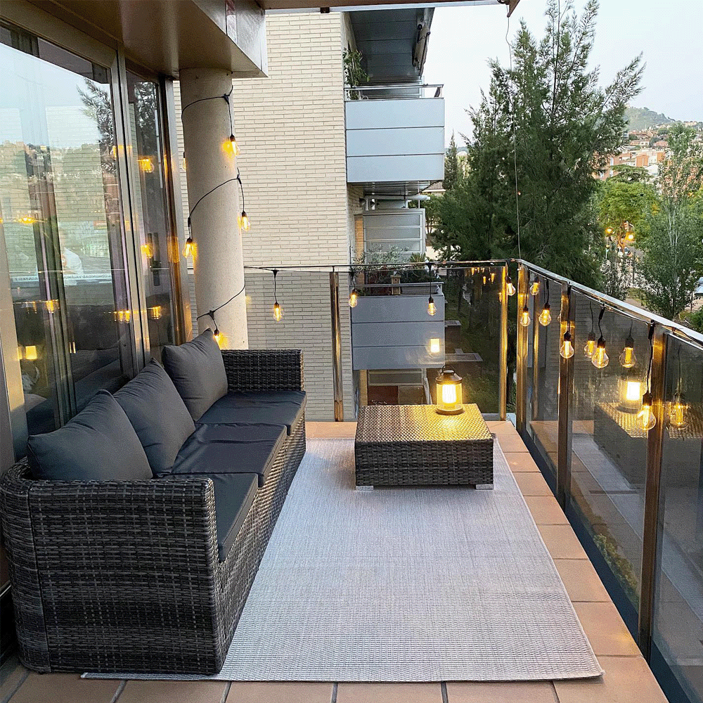 Modern balcony with string lights and a lantern